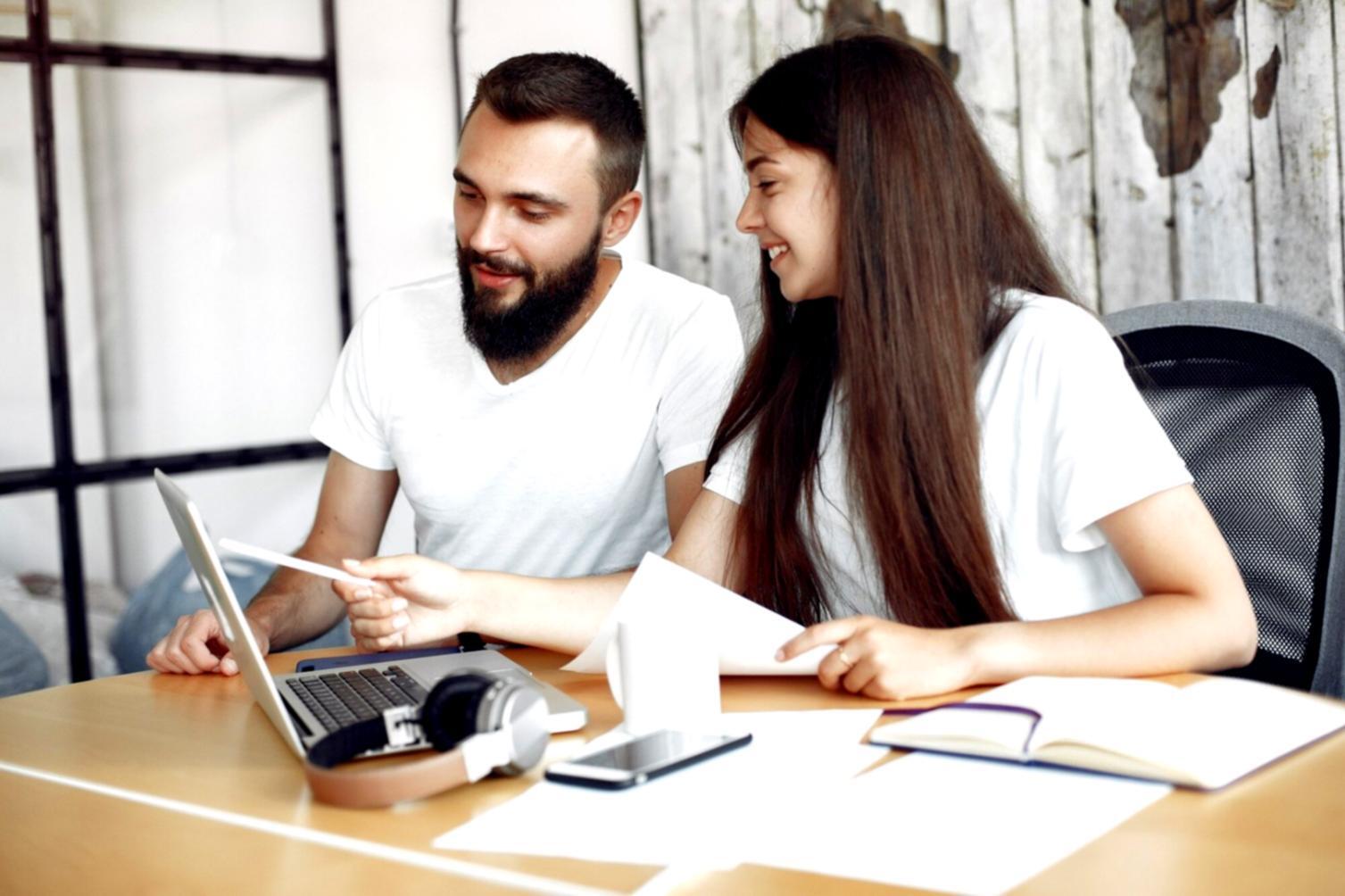 Modern investment analysis workspace with multiple monitors showing market data