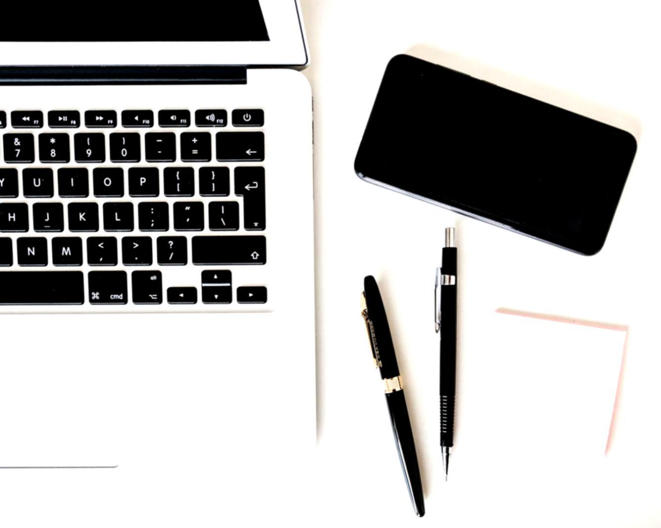 Modern computer setup displaying financial charts and investment analysis dashboard